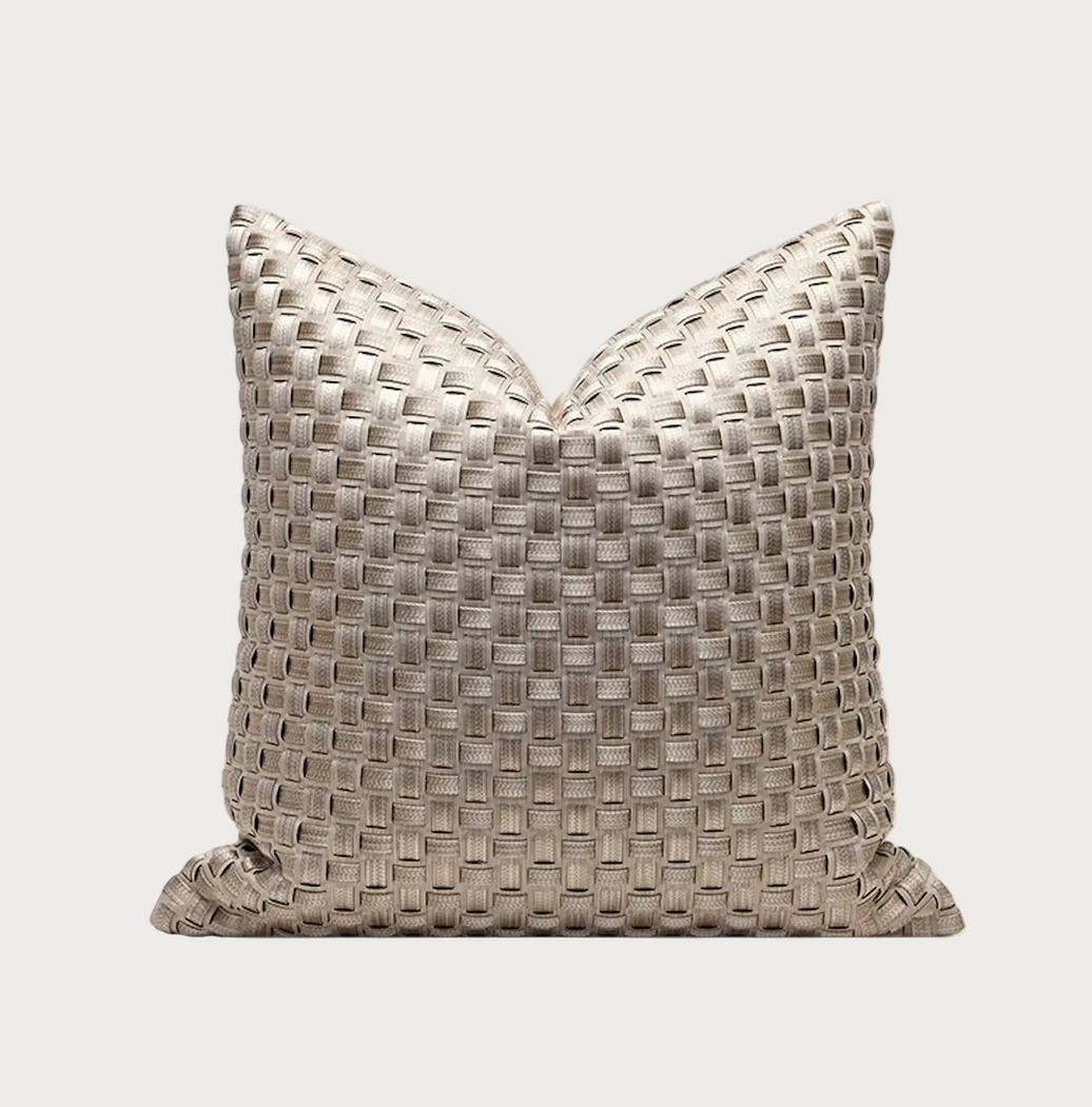 A square decorative throw pillow with a woven basketweave texture in a light taupe-beige color, shown against a plain white background.