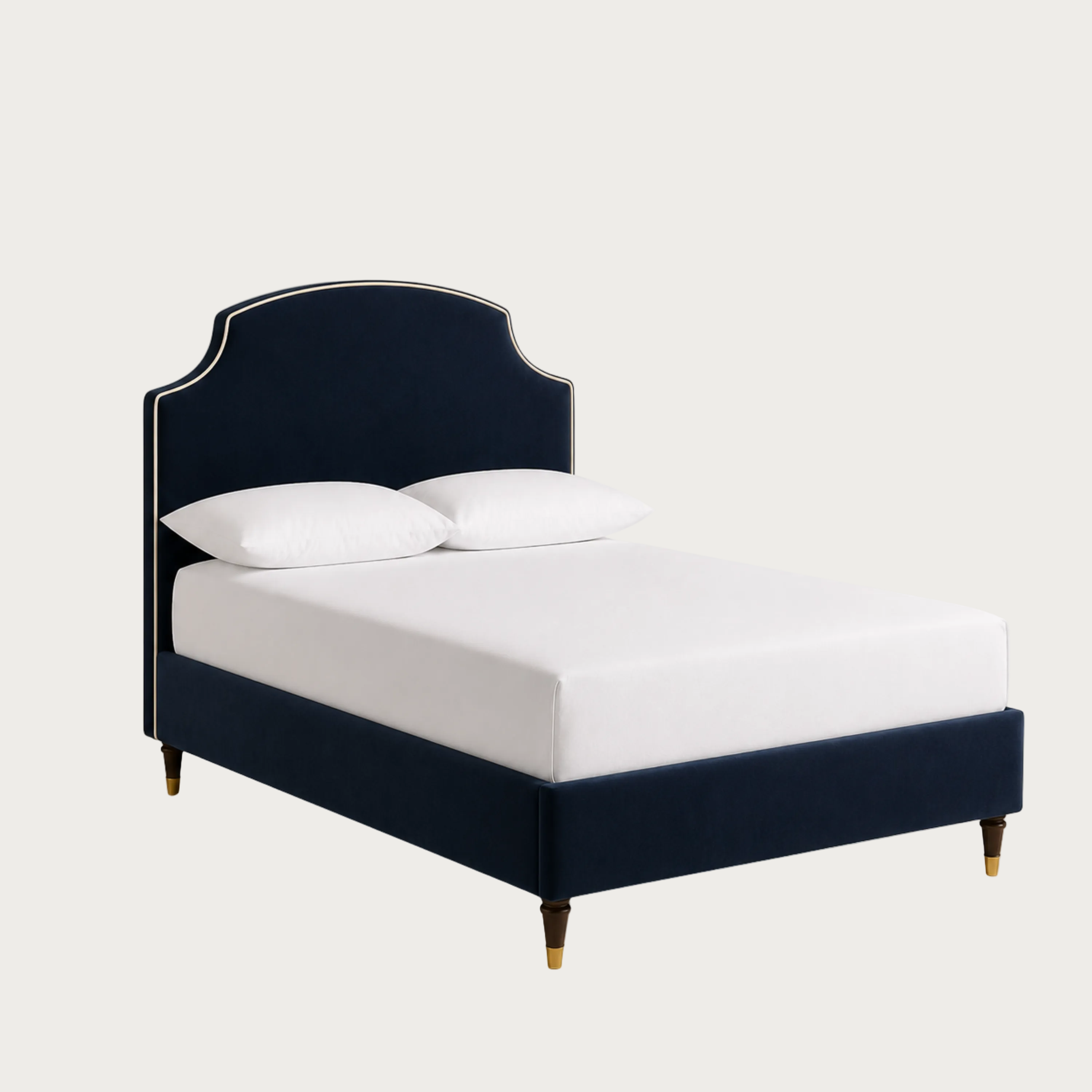 A navy blue upholstered bed frame with a curved headboard and matching footboard, shown with white bedding and two white pillows.
