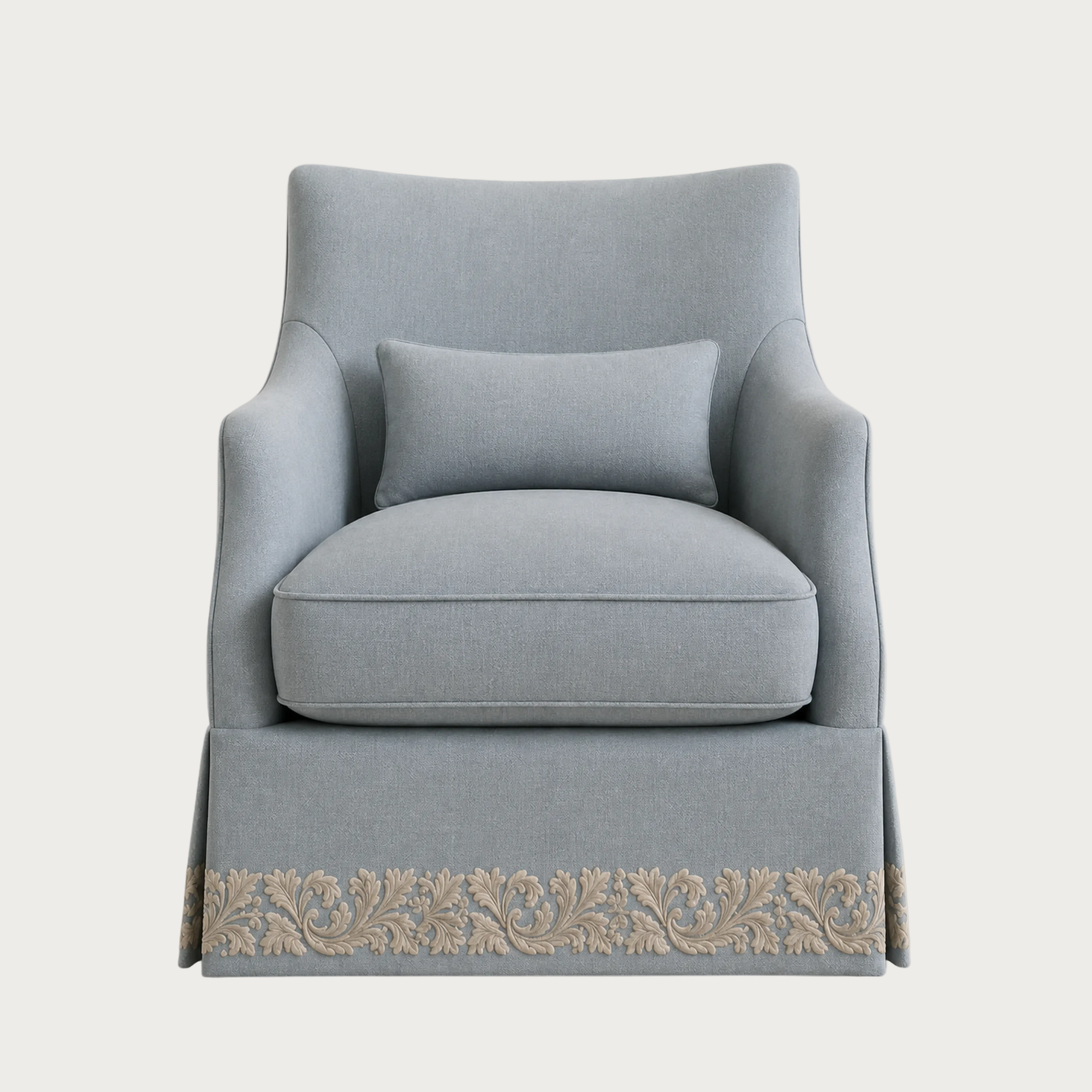 A light blue upholstered armchair with a matching lumbar pillow and a decorative beige floral border along the skirt, shown against a plain light gray background.