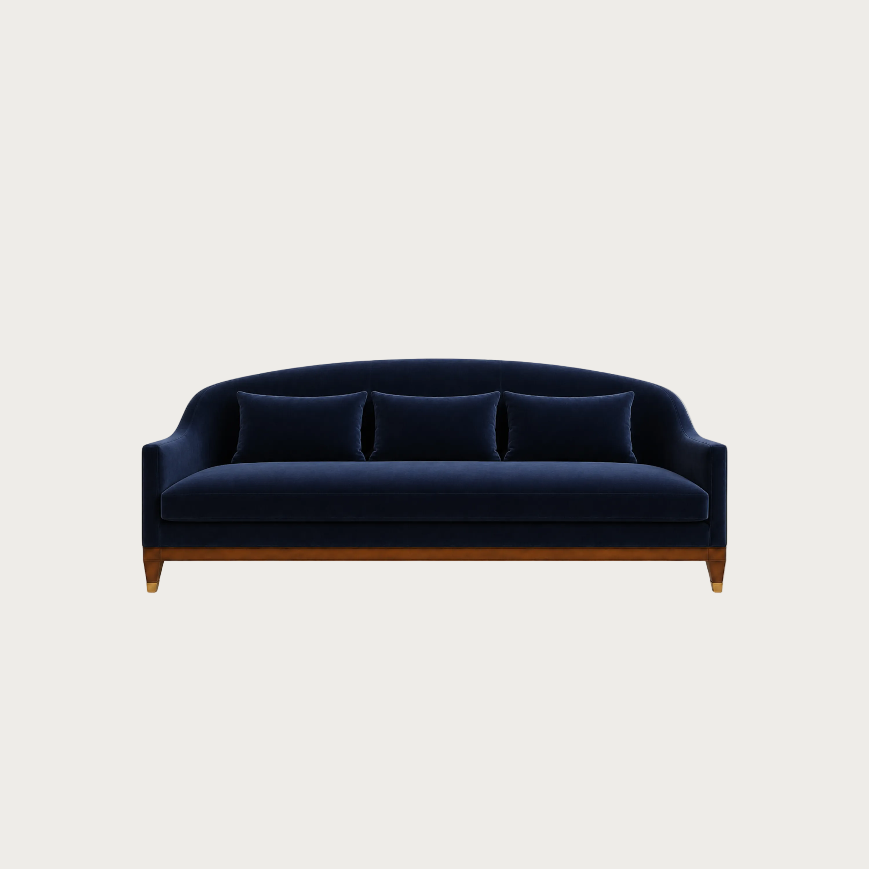A modern three-seater sofa upholstered in deep navy blue velvet with a curved backrest, three matching back cushions, and a medium brown wooden frame and legs, shown against a solid light gray background.