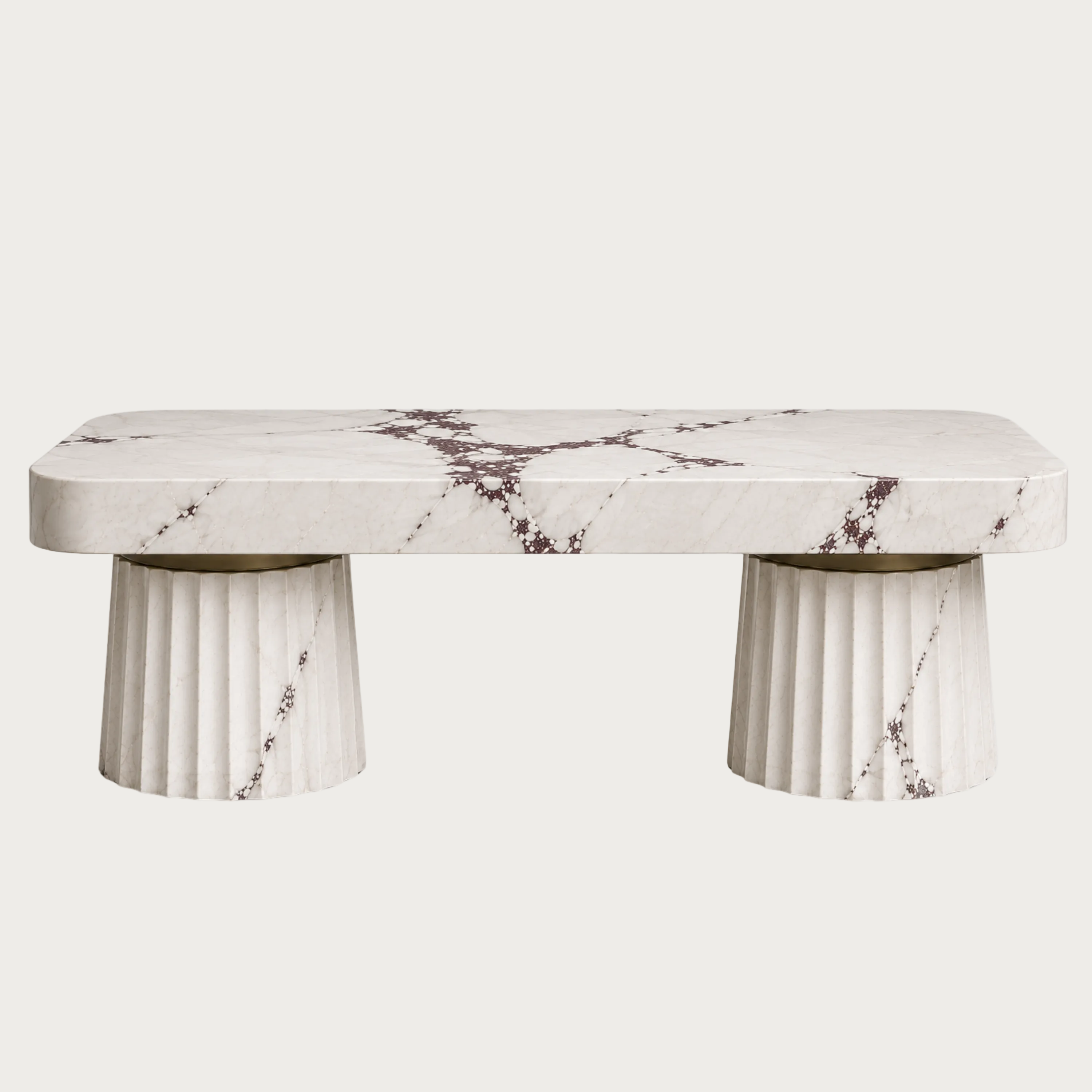 A modern rectangular kitchen Island made of white marble with dark brown veining, supported by two fluted cylindrical stone bases.