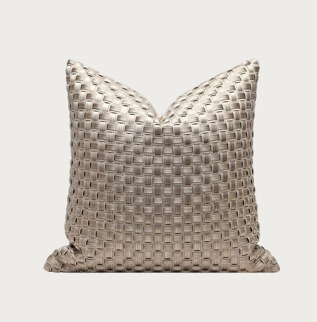 A square decorative throw pillow with a woven basketweave texture in a light taupe-beige color, shown against a plain white background.