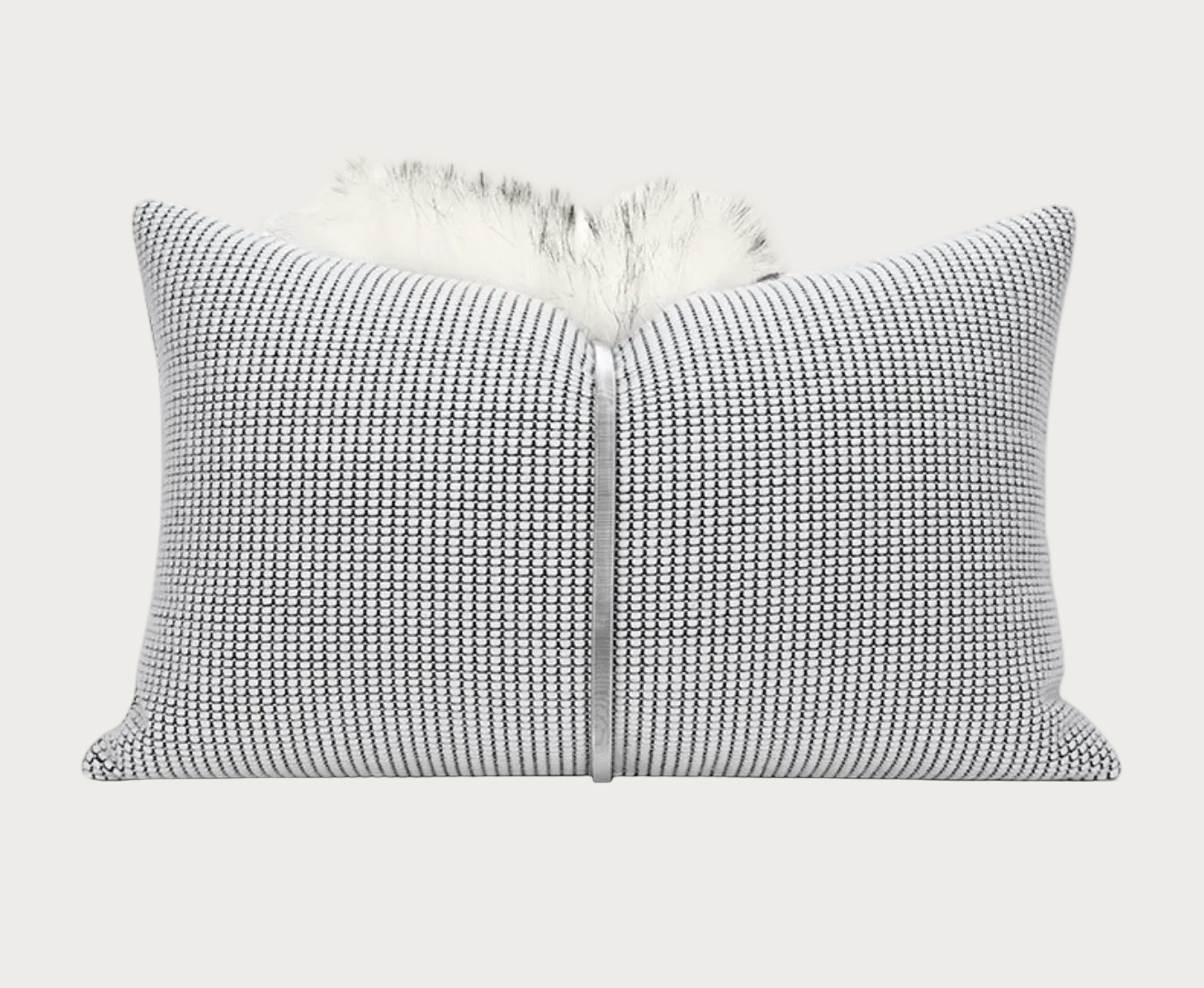 A square throw pillow featuring a textured black and white woven pattern, with a fluffy white faux fur trim along the top edge, shown against a plain white background.
