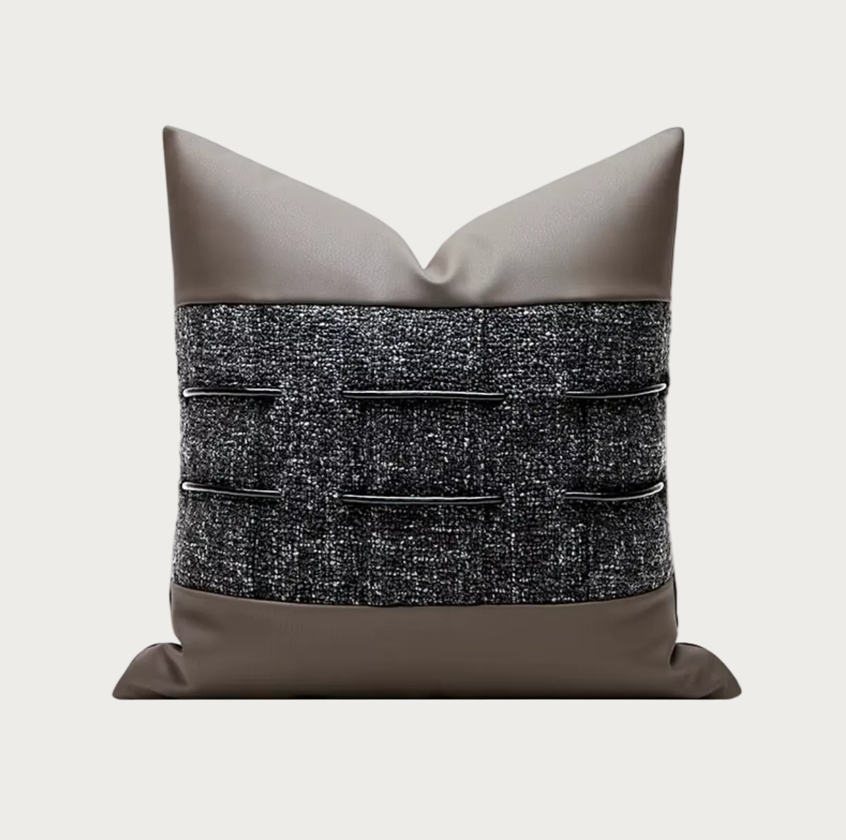 A square decorative throw pillow with a taupe faux-leather top and bottom and a textured black and gray tweed center panel featuring horizontal black leather tabs.