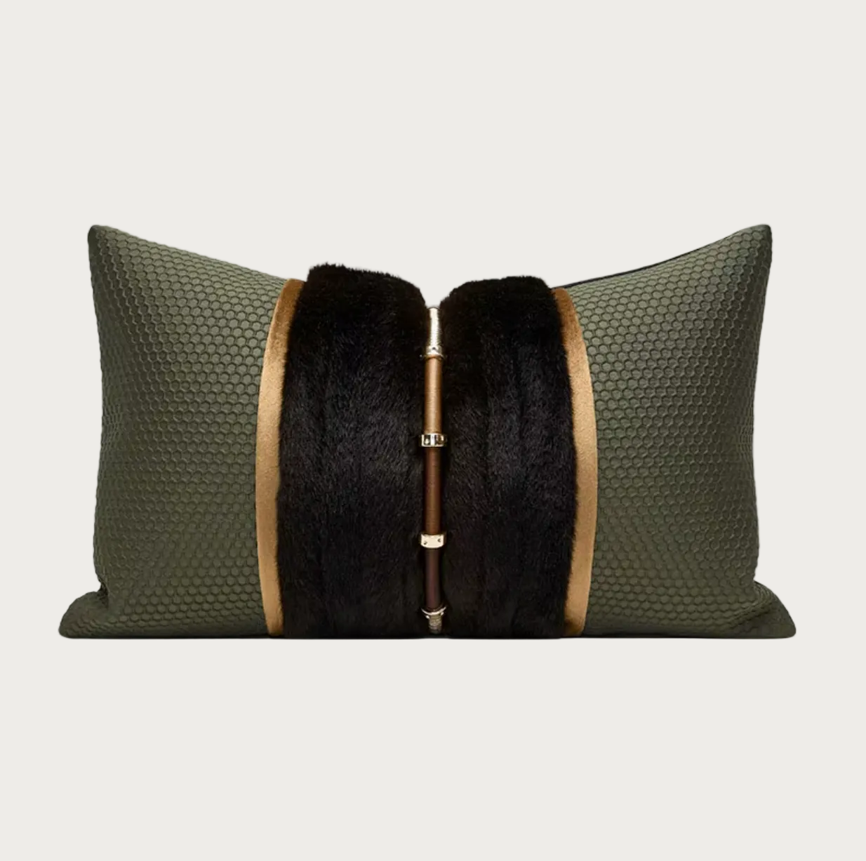 An olive green textured lumbar pillow featuring a central black fur panel and a vertical gold-tone metal rod with decorative rings.