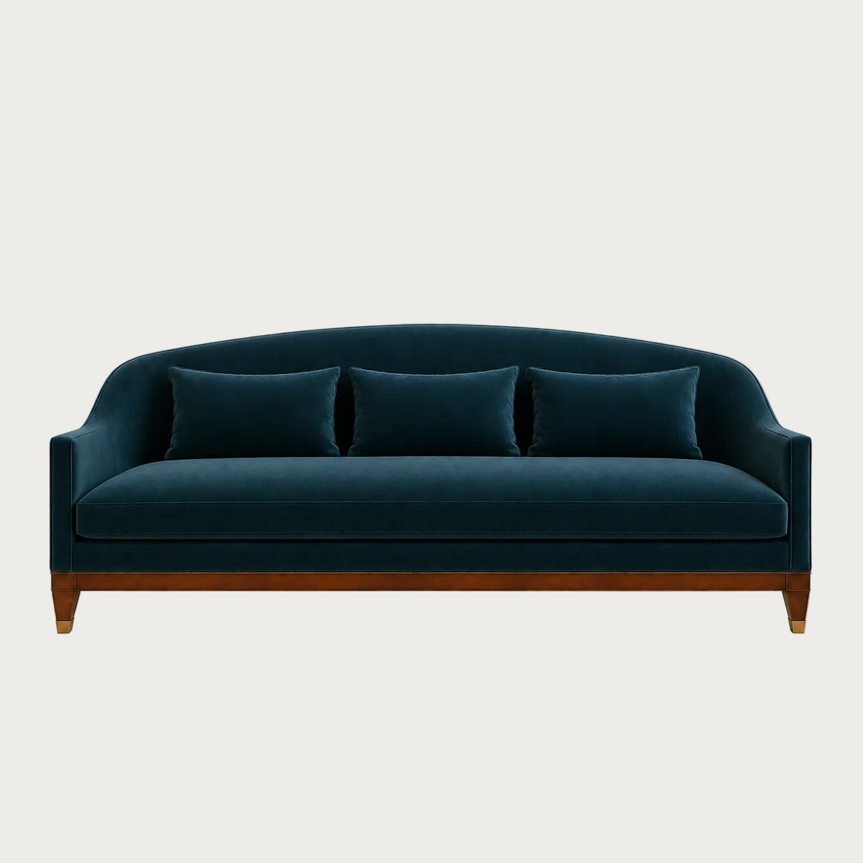 A modern three-seat sofa upholstered in deep teal velvet with a curved backrest, three matching throw pillows, and a medium brown wooden frame with tapered legs, shown against a solid off-white background.