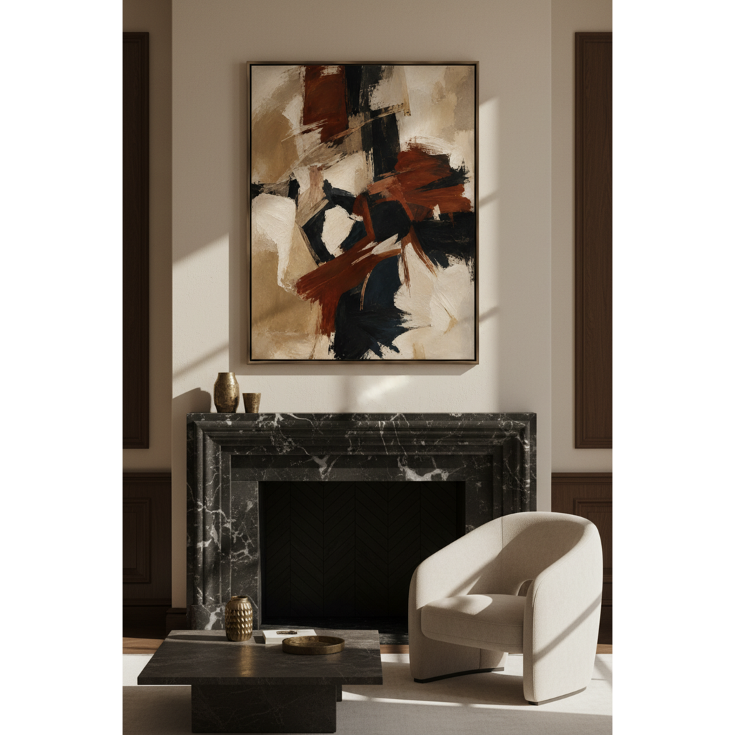 An abstract canvas print with brown, black, and beige brushstrokes hangs above a black marble fireplace in a modern living room setting with a cream armchair and a dark coffee table.