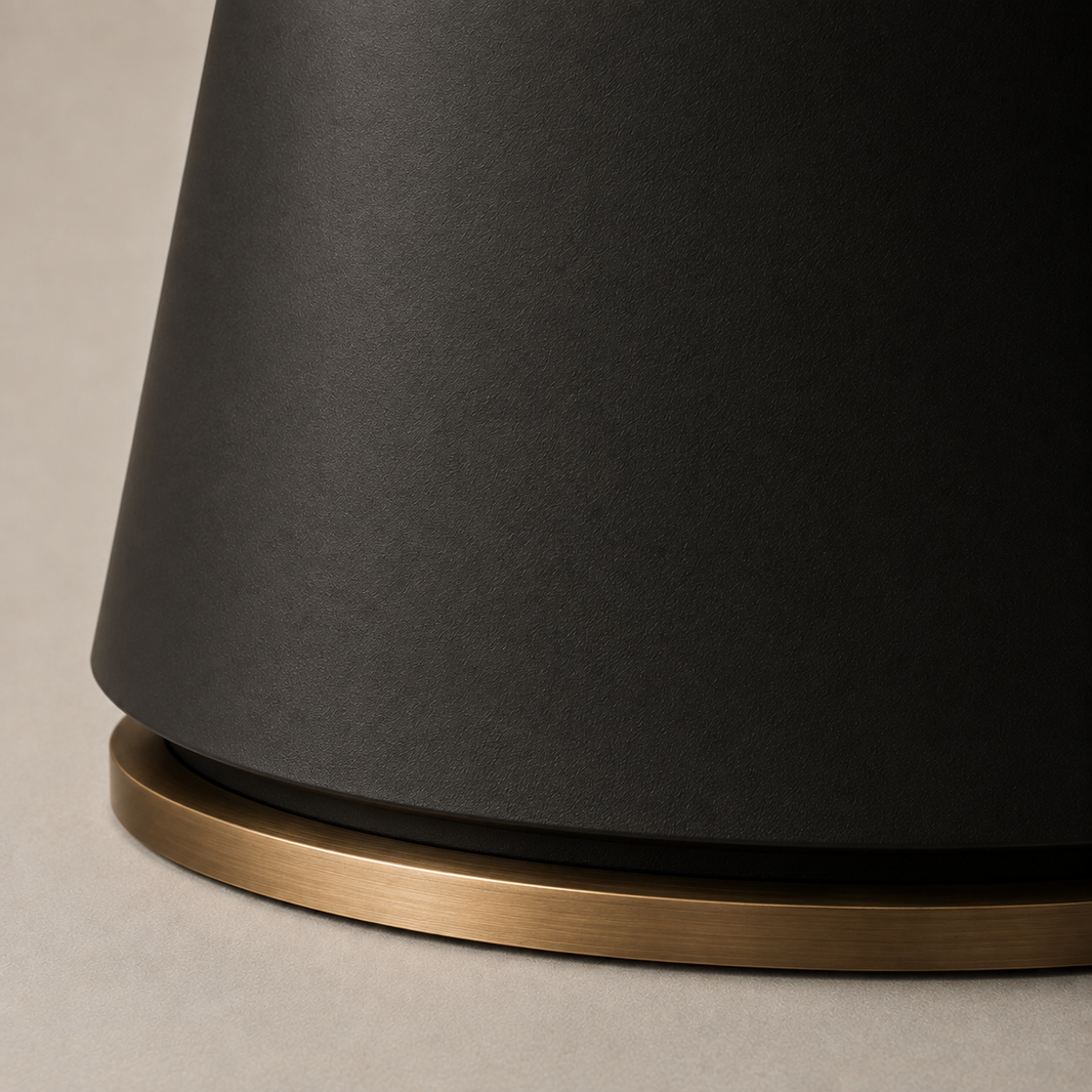 Sculptural ebonized pedestal of the Rothwell Dining Table with tonal hand-finished botanical bas-relief