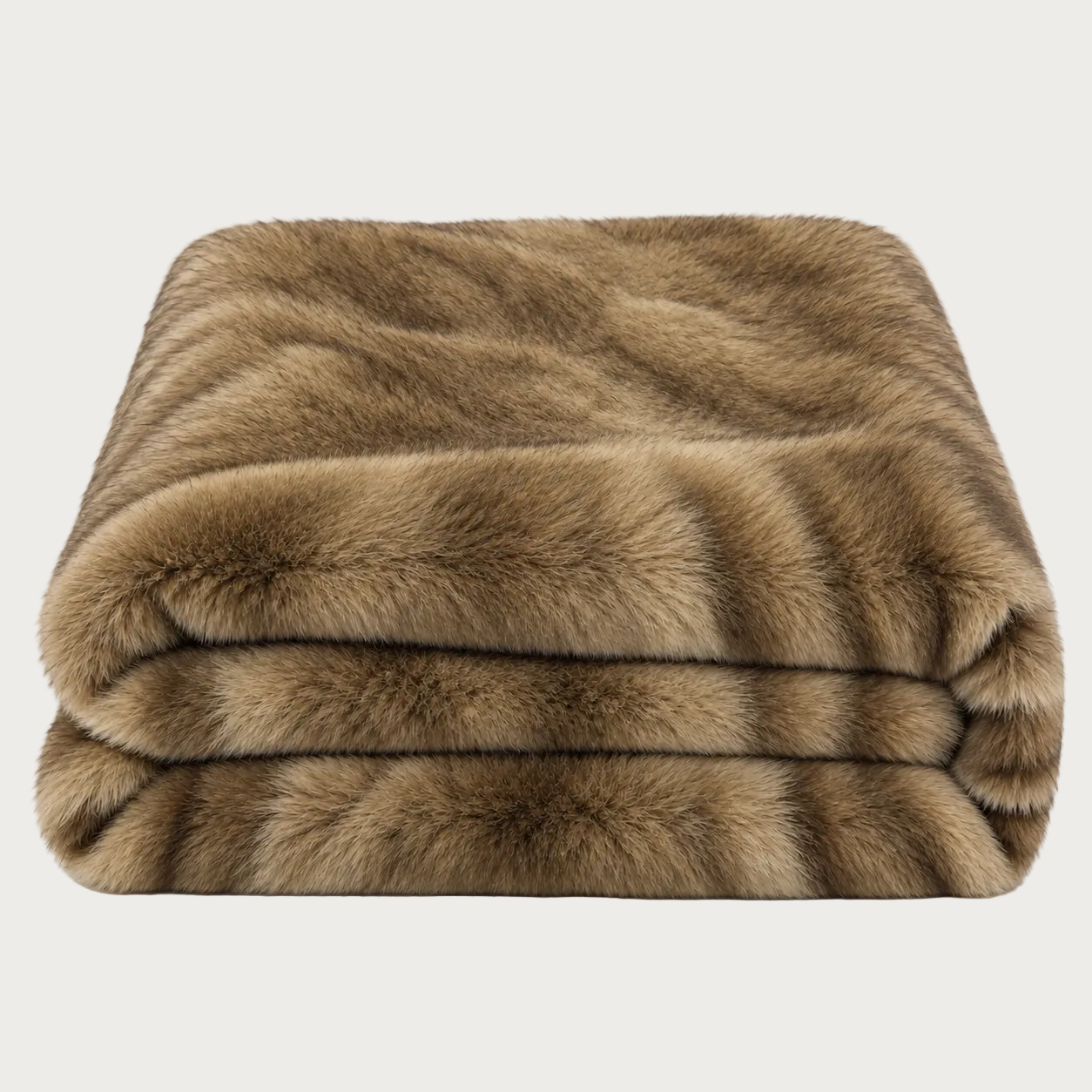 A folded faux fur throw blanket in a warm brown and tan colorway, shown against a plain white background.